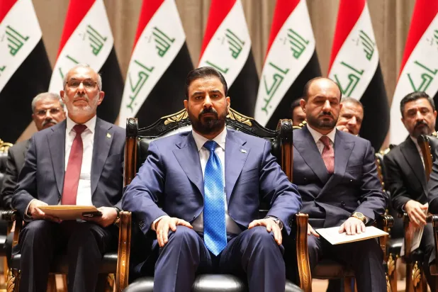 This handout picture released by the Iraqi Prime Minister's Press Office shows new prime minister-designate Ali al-Zaidi (C) sitting ahead of presenting his government to the parliament in Baghdad on May 14, 2026. (Iraqi Prime Minister’s Press Office / AFP)