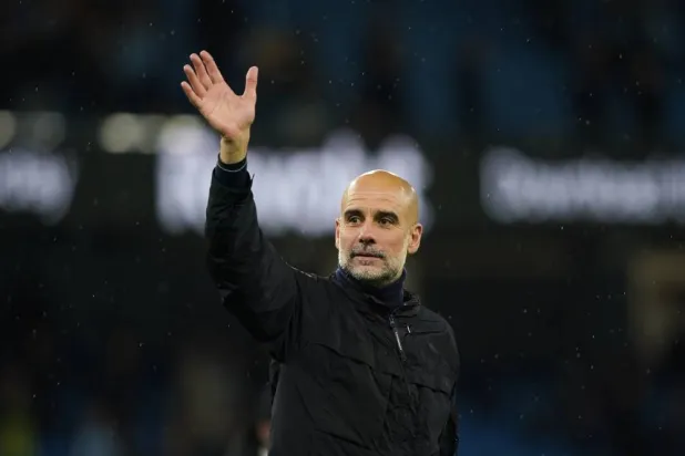  Manchester City's head coach Pep Guardiola greets fans at the end of the English Premier League soccer match between Manchester City and Crystal Palace in Manchester, England, Wednesday, May 13, 2026. (AP) 