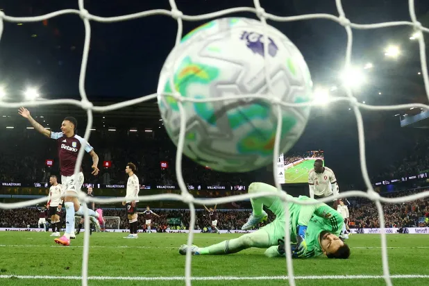 Football - Premier League - Aston Villa v Liverpool - Villa Park, Birmingham, Britain - May 15, 2026 Aston Villa's John McGinn scores their fourth goal past Liverpool's Giorgi Mamardashvili. (Action Images via Reuters/Andrew Boyers)