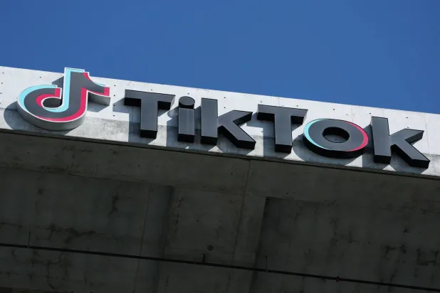 The TikTok logo is displayed on signage outside TikTok social media app company offices in Culver City, California on September 30, 2025. (AFP)