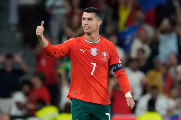Portugal's Cristiano Ronaldo celebrates after scoring during a World Cup 2026 group F qualifying soccer match between Portugal and Hungary in Lisbon, Oct. 14, 2025. (AP)