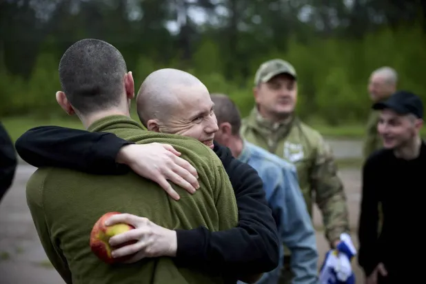 A handout photo made available by the Ukrainian Presidential Press Service shows Ukrainian prisoners of war (POWs) reacting following their release in a prisoner swap at an undisclosed location in Ukraine, 15 May 2026. (EPA/Ukrainian Presidential Press Service Handout)