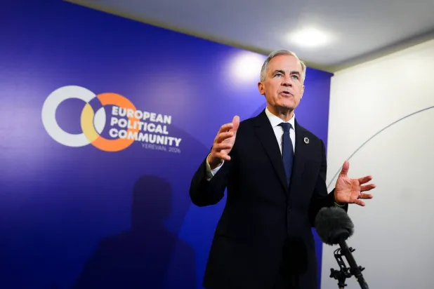 Canada Prime Minister Mark Carney talks to reporters during the 8th European Political Community Summit in Yerevan, Armenia on Monday, May 4, 2026. (Sean Kilpatrick/The Canadian Press via AP)