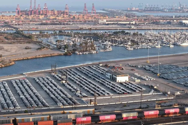 An aerial view of newly imported cars parked at the automobile terminal at the Port of Los Angeles on May 08, 2026 in Wilmington, California. (Getty Images/AFP)