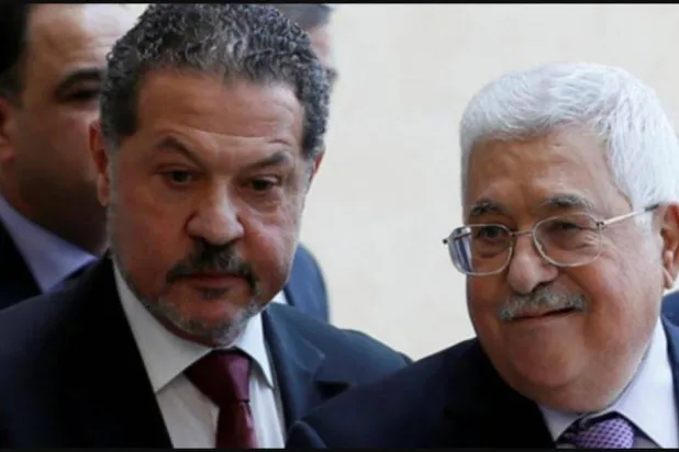 Palestinian President Mahmoud Abbas with his son Yasser in Ramallah, West Bank, on May 28, 2018 (Reuters file photo)
