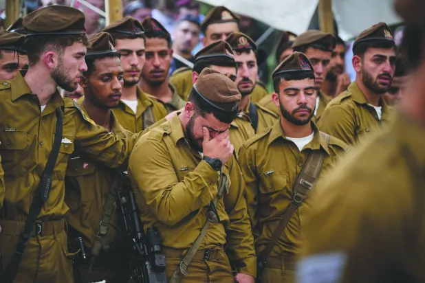 Israeli soldiers attend the funeral of Capt. Maoz Israel Recanati, who was killed in a Lebanese drone attack in southern Lebanon, at Mt. Herzl Military Cemetery in Jerusalem Sunday, May 17, 2026. (AP Photo/Ohad Zwigenberg)