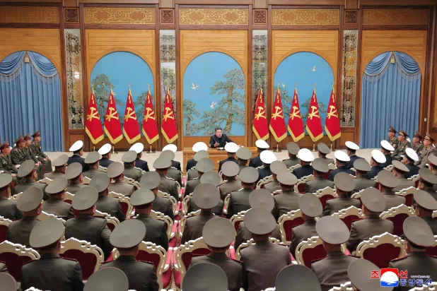 This picture taken on May 17, 2026 and released by North Korea's official Korean Central News Agency (KCNA) on May 18, 2026 shows North Korean leader Kim Jong Un (top C) speaking on key military issues during a meeting of commanding officers of the divisions and brigades of the entire army at the Party Central Committee headquarters in Pyongyang. (KCNA via KNS / AFP) 