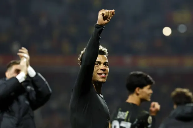 Paris Saint-Germain's French midfielder #14 Desire Doue celebrates his team victory at the end of the French L1 football match between RC Lens and Paris Saint-Germain (PSG) at the Stade Bollaert-Delelis stadium in Lens on May 13, 2026. (AFP)