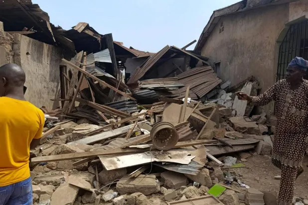 Residents inspect the damage after US forces launched a strike against ISIS group militants in Nigeria at the request of Nigeria's government. Abdullahi Dare Akogu, Reuters
