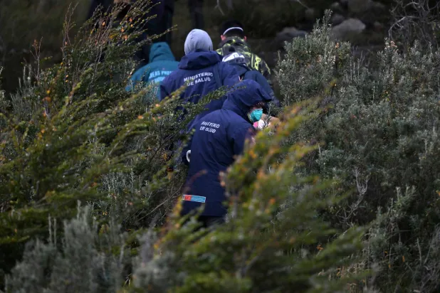 Scientist of the Malbran institute, members of Health Minister of Argentine province of Tierra del Fuego and members of National Park Administration walk in the forest to place mouse traps near Ushuaia, Argentina on May 18, 2026. (AFP)
