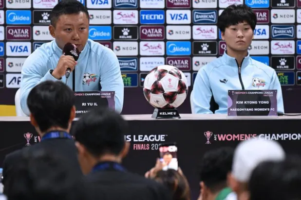 North Korea's Naegohyang Women's FC head coach Ri Yu Il (L) and captain Kim Kyong Yong (R) attend a press conference at Suwon Sports Complex ahead of the Women's Asian Champions League semi-final. JUNG YEON-JE / POOL/AFP
