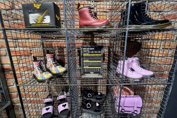 Dr. Martens shoes are displayed inside a shop in Manchester, Britain, May 26, 2023. (Reuters) 