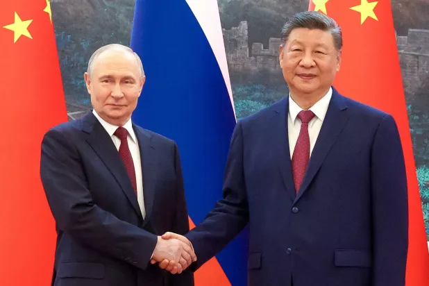  Russian President Vladimir Putin and Chinese President Xi Jinping pose for a picture during a meeting at the Great Hall of the People in Beijing, China May 20, 2026. (Sputnik/Maxim Stulov/Pool via Reuters)