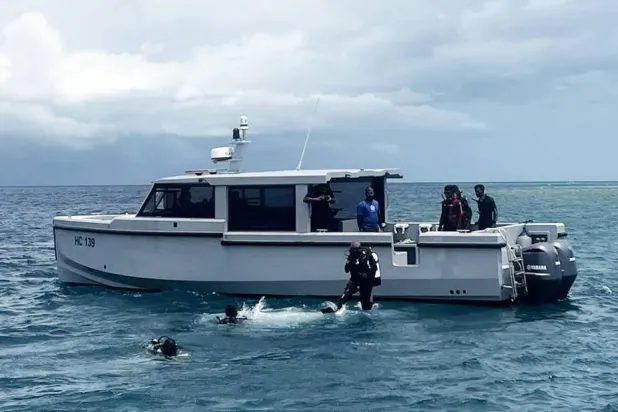 A handout photo made available by the Maldives President's Media Division shows divers conduct search and recovery operations for the remaining bodies of Italian tourists in the waters of Vaavu Atoll, Maldives, 20 May 2026. EPA/Maldives President's Media Division Handout 