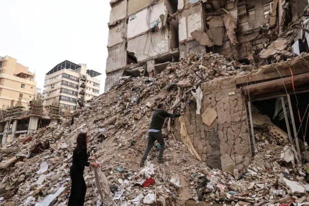 Ghida Krisht and Wael Sabbagh both lost relatives in an Israeli strikes. Anwar AMRO / AFP
