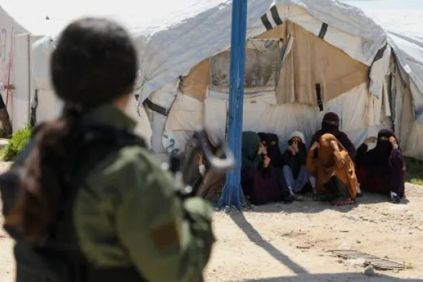 Members of Australian families believed to be linked to the ISIS militants wait to leave Roj camp near Derik, Syria April 24, 2026. REUTERS/Orhan Qereman/File Photo 