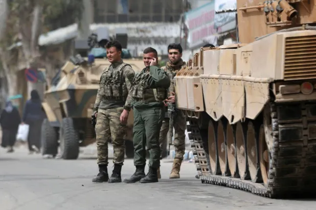 Turkish soldiers are seen in the center of Afrin, Syria. REUTERS/Khalil Ashawi