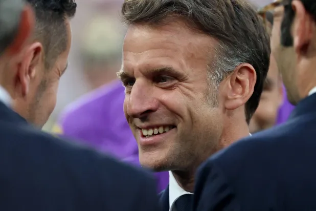 France's President Emmanuel Macron (C) speaks with Lens' French head coach Pierre Sage (L) ahead of the French Cup final football match between RC Lens and OGC Nice at the Stade de France stadium, in Saint-Denis, on the outskirts of Paris, on May 22, 2026. (AFP)