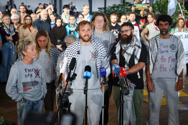 Members of a Gaza-bound flotilla, that were detained by Israeli security forces last week, speak during a press conference after arriving at Sydney International Airport on May 25, 2026. (AFP)