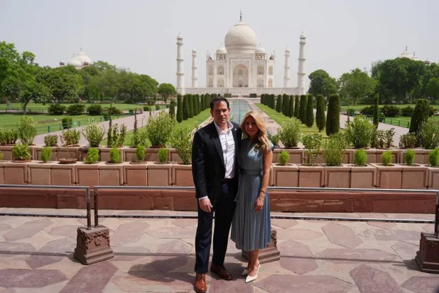 United States Secretary of State Marco Rubio poses with his wife, Jeanette Rubio, during their visit to the Taj Mahal in Agra, India, Monday, May 25, 2026. Pool via Reuters