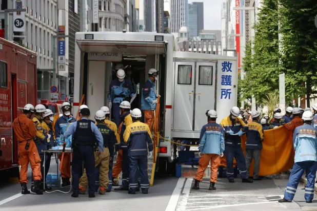 Emergency personnel work outside the Ginza Six luxury shopping complex in Tokyo's Ginza district, Japan, 25 May 2026. (EPA)