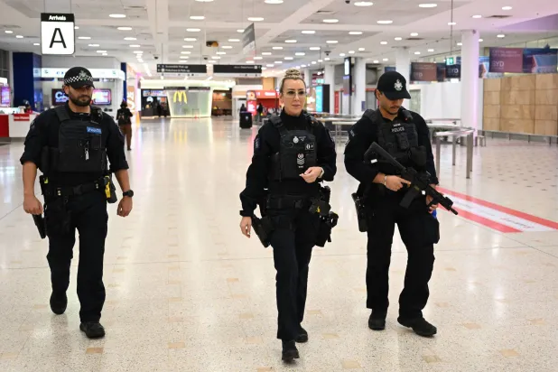 Australian Federal Police officers patrol Sydney International Airport, in Sydney, Australia, 26 May 2026. EPA/DEAN LEWINS 