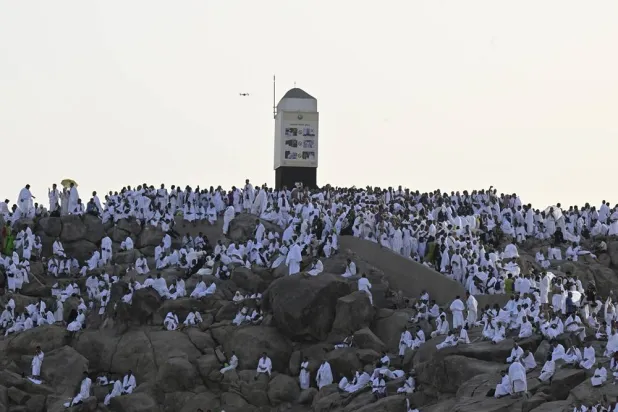 Muslim pilgrims gather at Jabal al-Rahmah (Mount of Mercy) in the Arafat region near Makkah, Saudi Arabia, 26 May 2026. (EPA)