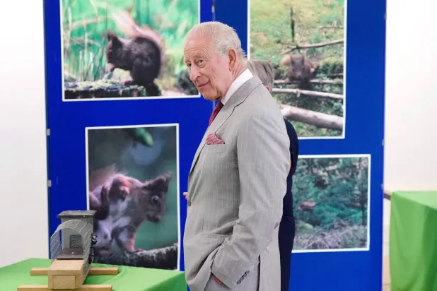Britain's King Charles III smiles as he visits a conservation initiative to humanely control grey squirrel numbers, at the Animal and Plant Health Agency, in Sand Hutton, North Yorkshire, north-east England, on May 26, 2026. (Photo by Dominic Lipinski / POOL / AFP)