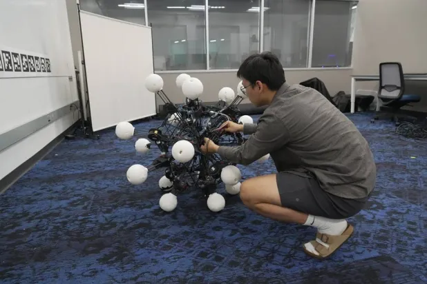  Jiaxun Liu, a PhD student, works on a robot named Argus at Duke University's General Robotics Lab in Durham, NC, Tuesday, May 26, 2026. (AP) 