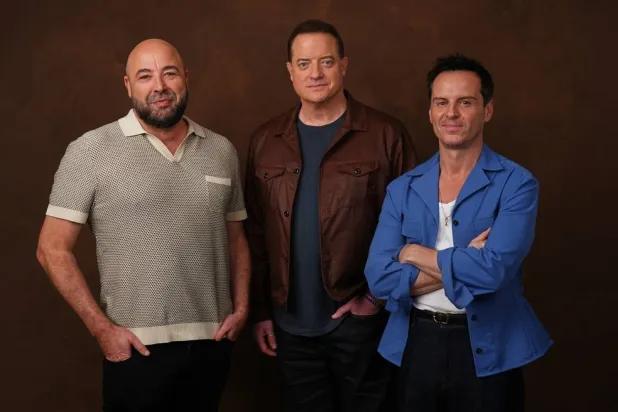  Anthony Maras, left, director/co-writer of the film "Pressure," poses with cast members Brendan Fraser, center, and Andrew Scott on Tuesday, May 12, 2026, in Los Angeles. (AP Photo/Chris Pizzello) 