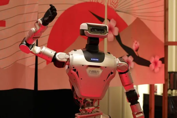 A humanoid robot poses for photo at the Humanoids Summit 2026 in Tokyo, Thursday, May 28, 2026. (AP) 