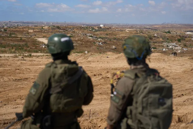 Israeli soldiers occupy a military position overlooking the so-called Yellow Line in the central Gaza Strip, Tuesday, May 26, 2026. (AP Photo/Ariel Schalit)