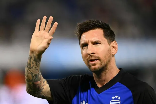 Argentina's forward #10 Lionel Messi waves to supporters as he warms up ahead of a friendly football match between Argentina and Zambia at La Bombonera stadium in Buenos Aires on March 31, 2026. (AFP)