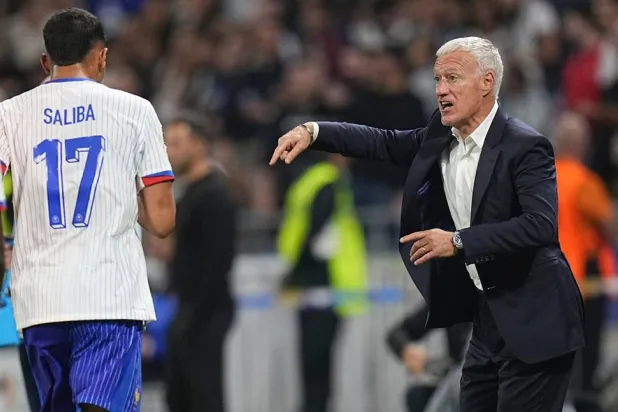France head coach Didier Deschamps, right, instructs his players after their second goal during the UEFA Nations League match between France and Belgium at the Groupama stadium in Decines, outside Lyon, France, Monday, Sept. 9, 2024. (AP)