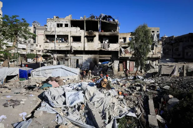 Palestinians inspect the damage at the site of an Israeli strike on Wednesday in Gaza City, May 28, 2026. REUTERS/Dawoud Abu Alkas