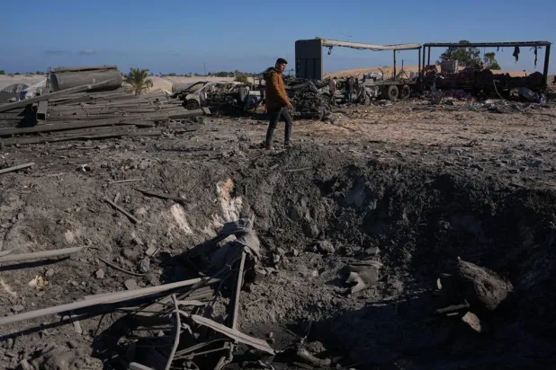 A Palestinian inspects the site of an Israeli strike in Khan Younis, southern Gaza Strip, Friday, May 29, 2026. (AP)