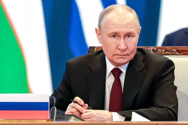 In this pool photograph distributed by the Russian state agency Sputnik Russia's President Vladimir Putin attends the extended-format meeting of the Supreme Eurasian Economic Council of the Eurasian Economic Union (EAEU) at the Palace of Independence in Astana on May 29, 2026. (AFP) 