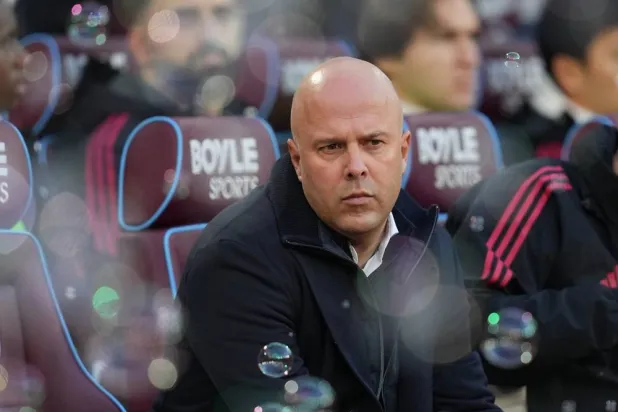 Liverpool's manager Arne Slot sits on the bench prior to the start of the English Premier League soccer match between West Ham United and Liverpool, in London, Sunday, Nov. 30, 2025. (AP)