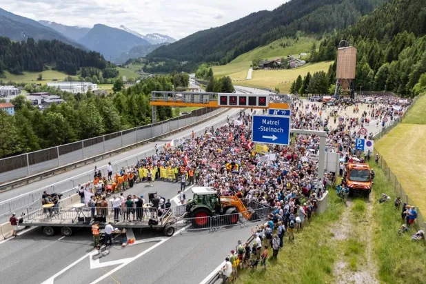 People demonstrate against transit traffic near the A13 Brenner Highway in the direction of Italy during the blockade of the Brenner Base Tunnel on May 30, 2026, on the Tyrolean Brenner Highway. (AFP)