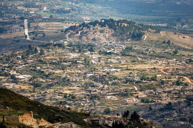 Destroyed buildings are pictured in the village of Kfar Kila in southern Lebanon as seen from across the border in the Upper Galilee region of northern Israel on May 29, 2026. (AFP)