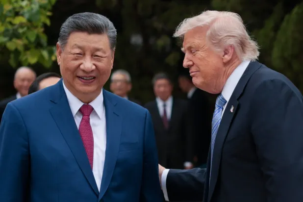 US President Donald Trump, right, speaks with Chinese President Xi Jinping while leaving after a visit to the Zhongnanhai Garden in Beijing, Friday, May 15, 2026. (Evan Vucci/Pool Photo via AP) 