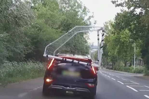 A photo shows the unsecured football net on top of the British driver’s car (Hertfordshire Police)