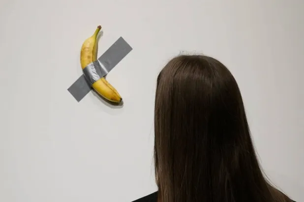 Italian visual artist Maurizio Cattelan's conceptual work 'Comedian' has sold for millions. TIMOTHY A. CLARY / AFP/File
