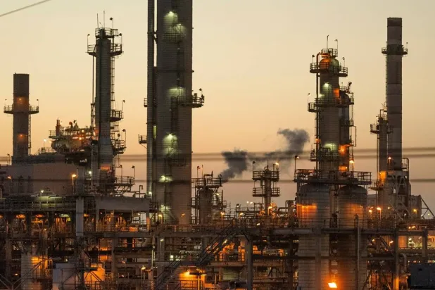 Lights illuminate an oil refinery in Carson, Calif., May 29, 2024. (AP)
