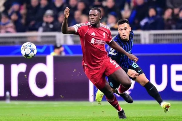Inter Milan's Argentinian forward #10 Lautaro Martinez fights for the ball with Liverpool's French defender #05 Ibrahima Konate during the UEFA Champions League phase day 6 football match between Inter Milan and Liverpool at San Siro stadium in Milan, on December 9, 2025. (AFP)