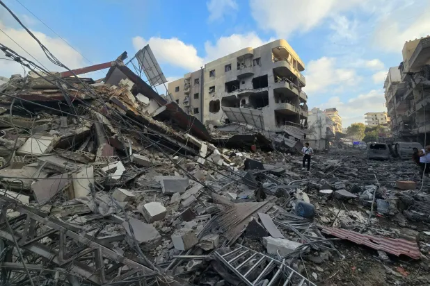 People gather at the site of an Israeli strike that hit near a hospital in the southern Lebanese city of Tyre on June 1, 2026. (AFP)