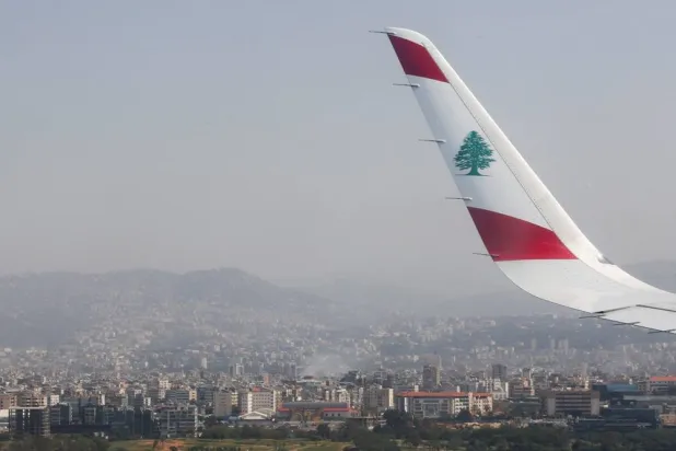An aerial view from the window of a Lebanese Middle East Airlines (MEA) airplane shows smoke rising, after Israeli strikes following an escalation between Hezbollah and Israel, amid the US-Israeli conflict with Iran, in the southern suburbs of Beirut, Lebanon, March 12, 2026. (Reuters)