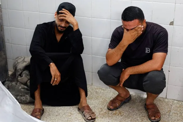 Mourners react during the funeral of brothers Saqer and Moamen ‌Khalil Abu Karim, who were killed in an Israeli strike, according to medics, at Al-Aqsa Martyrs Hospital in Deir al-Balah, in the central Gaza Strip, June 3, 2026. (Reuters)