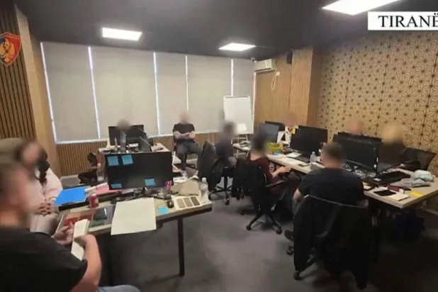 This image taken from a handout video released by Albanian police shows operators in an alleged cryptocurrency scam call center in Tirana in April 2026. Handout / ALBANIA POLICE/AFP
