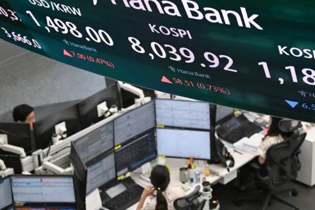 Seoul's Kospi, which has hit multiple records this year as it led Asian markets higher, tumbled Friday. Jung Yeon-je/ AFP
